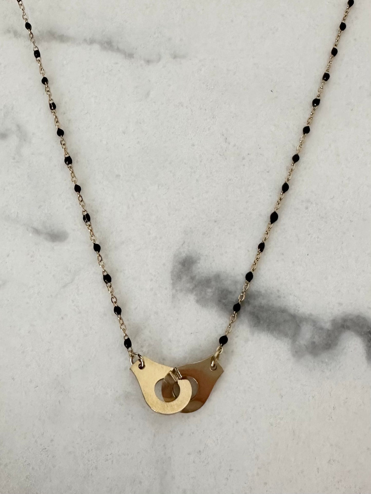 Collier Menottes noir et doré