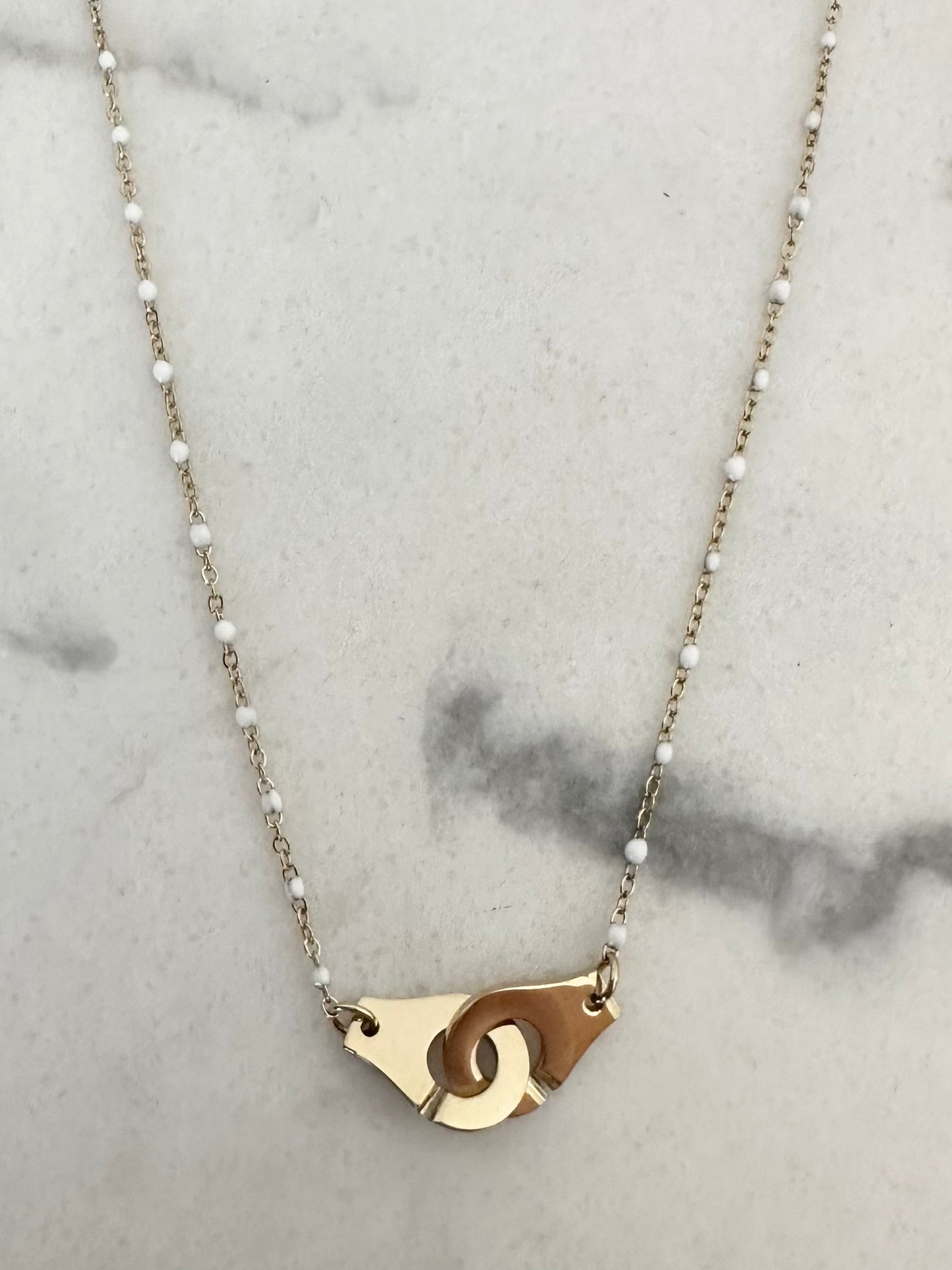 Collier Menottes blanc et doré
