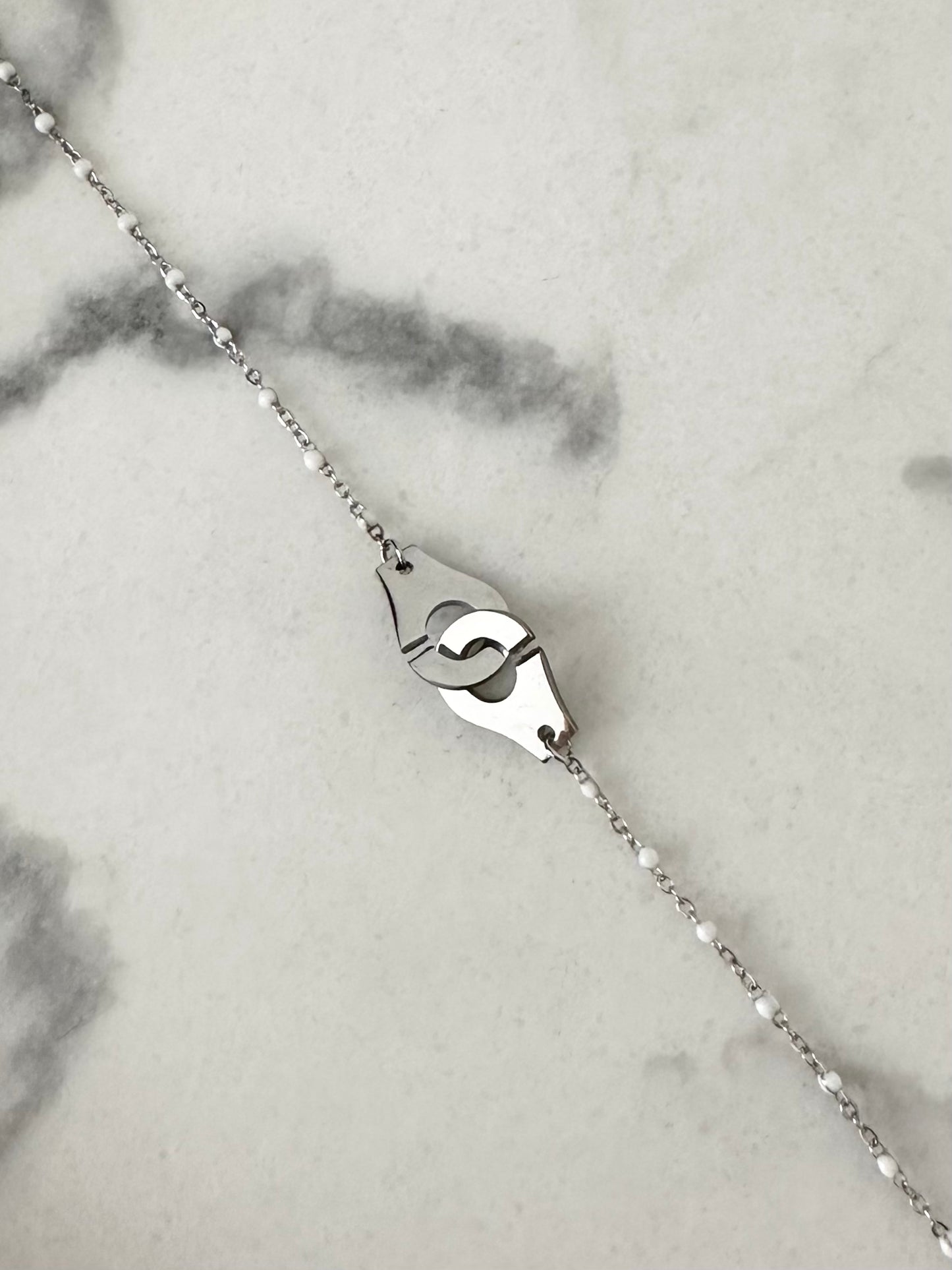 Bracelet Menottes blanc et argenté